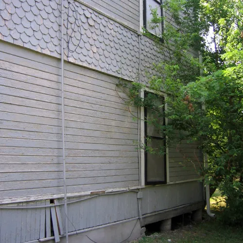 Exterior cladding & trim before restoration