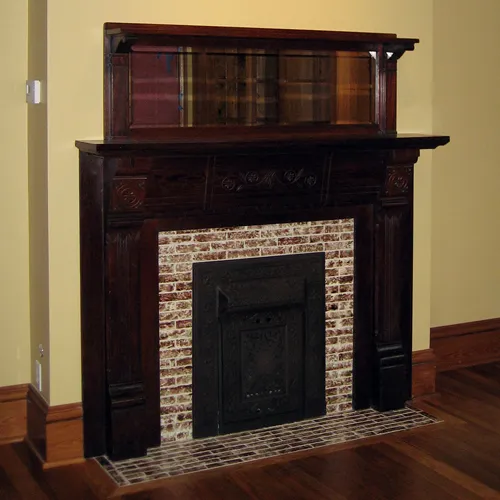 Interior fireplace and mantle after restoration